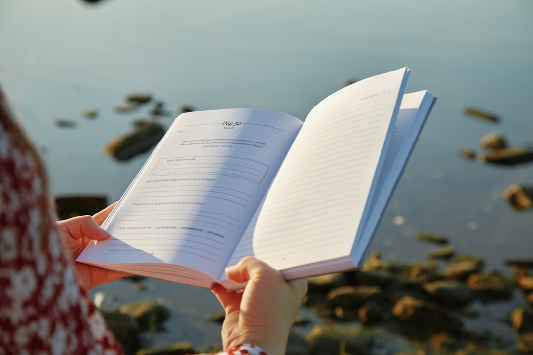 A person holding a book in their hands
