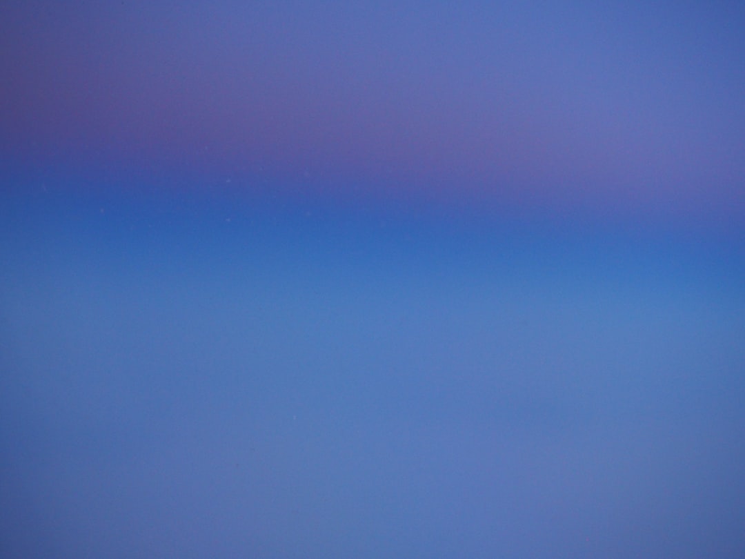 Abstract blue and purple gradient illustrating the ChatGPT Pro plan vs Claude Max $100 tier choice