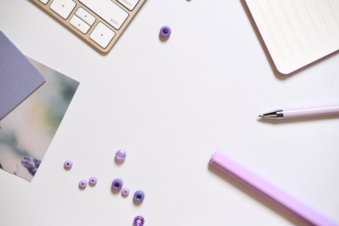 Gemini for freelancers workspace flat lay with notebook and purple desk supplies
