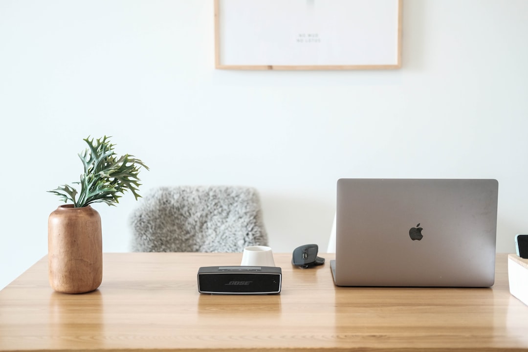 Slack for solo consultants workspace setup laptop on minimal desk