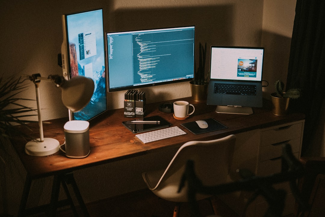 Dual monitors on a coding desk representing the Antigravity agent IDE workflow