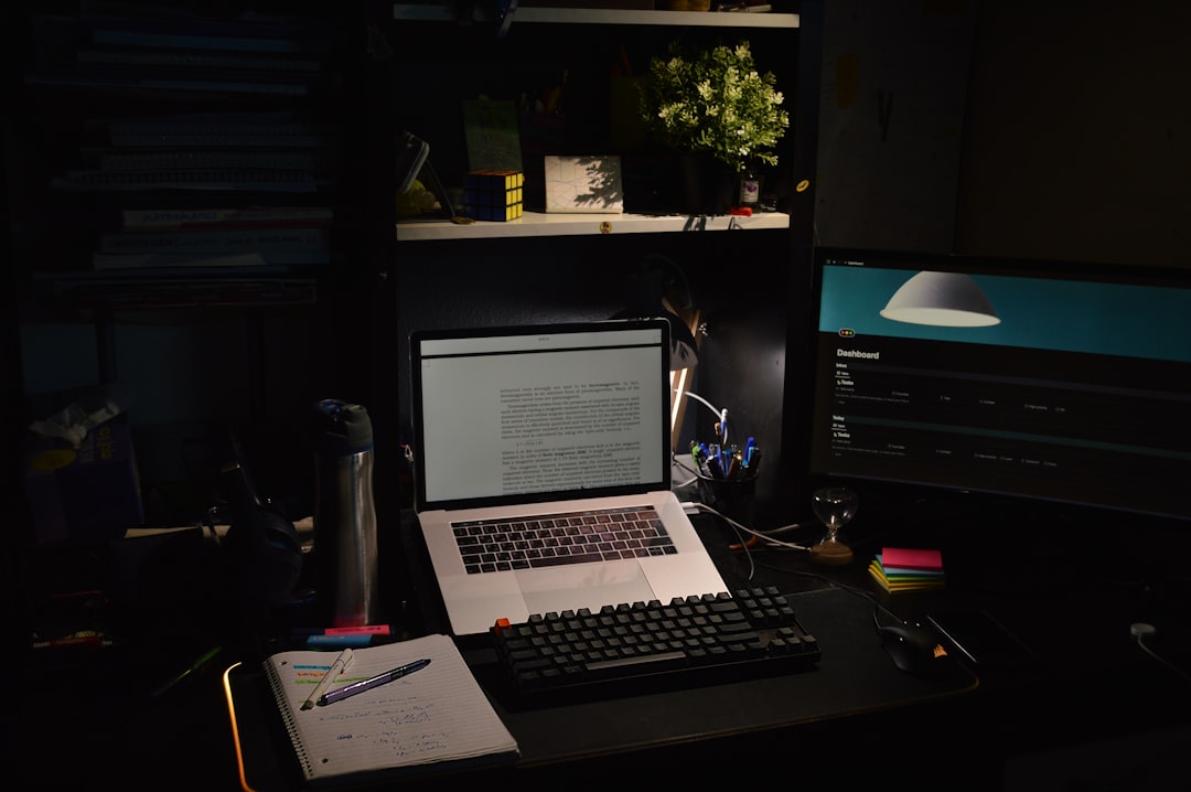 Claude Opus 5.5 pricing notes on a laptop at a solo coding and building desk